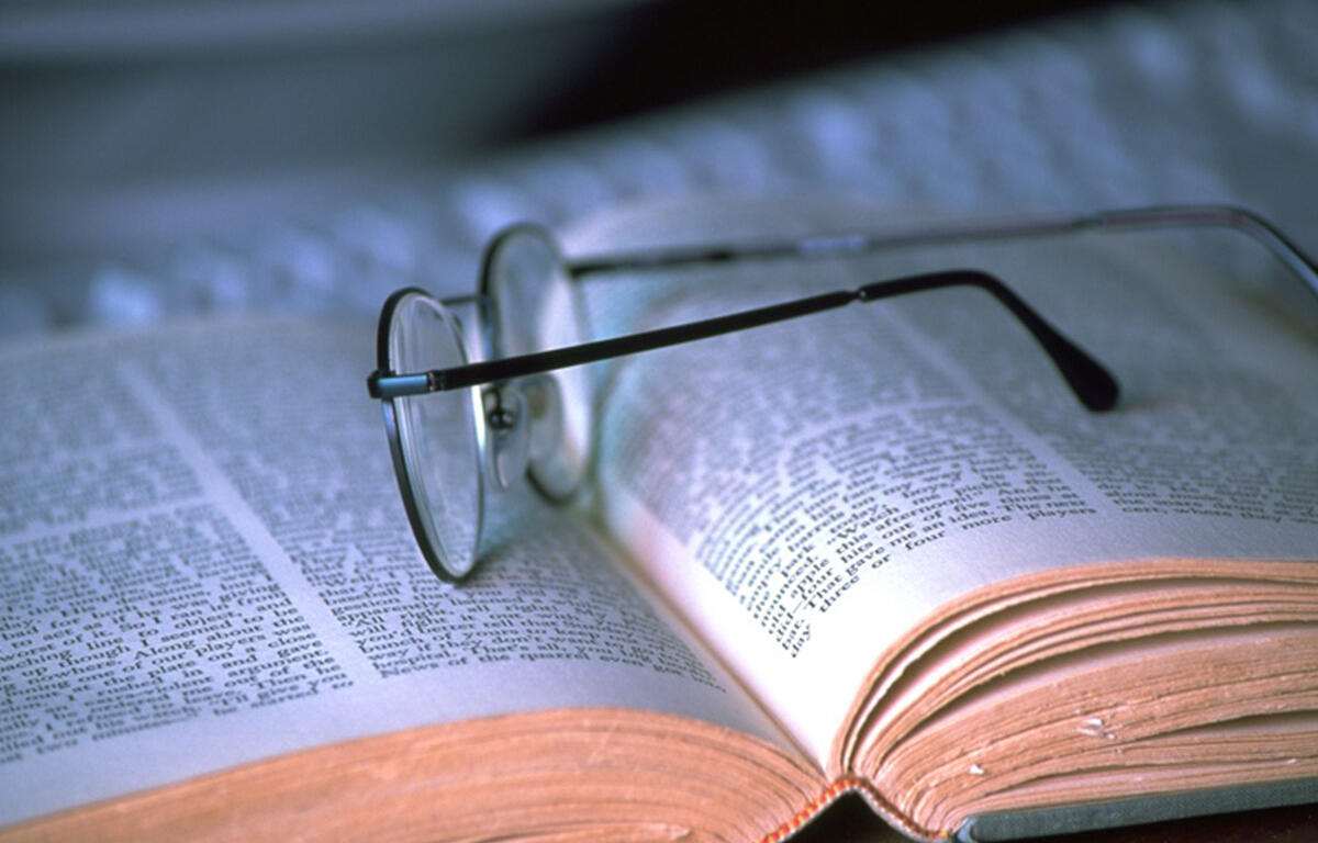 Book with reading glasses