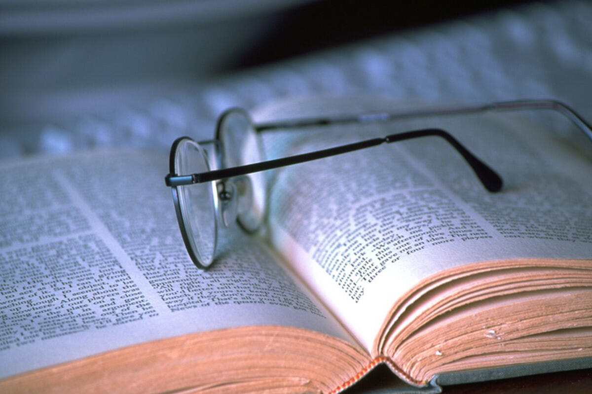 Book with reading glasses