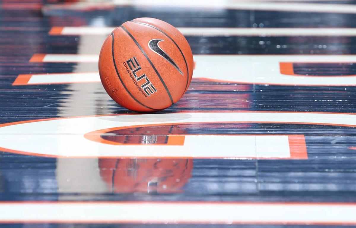 Basketball on court at John Paul Jones Arena