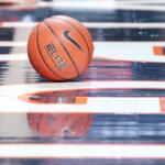 Basketball on court at John Paul Jones Arena