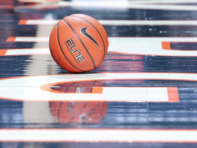 Basketball on court at John Paul Jones Arena
