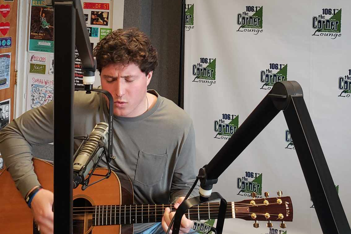 Jack Stepanian in the Corner studio singing and playing guitar