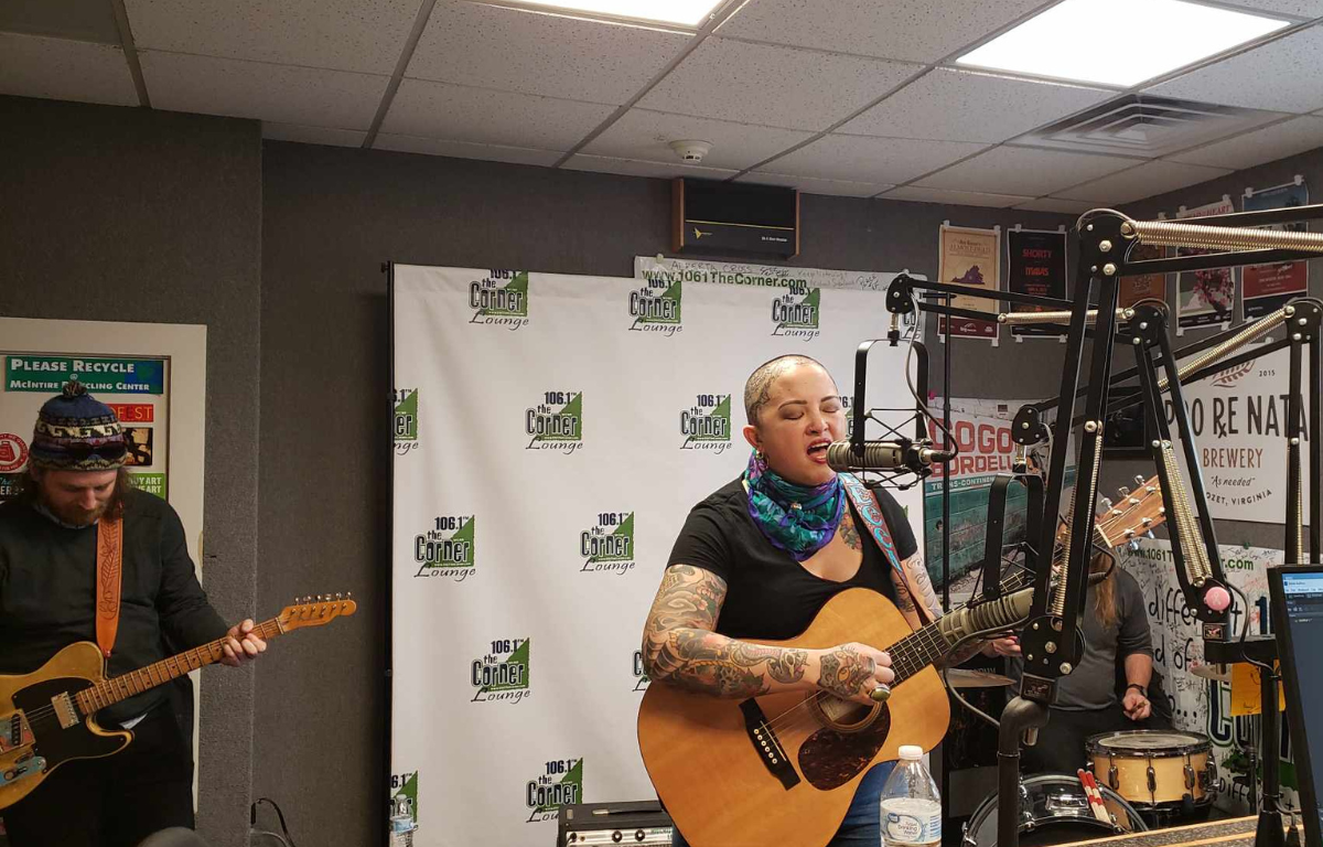 Rebecca Porter and the Rhinestone Roses singing and playing instruments in the Corner studio.