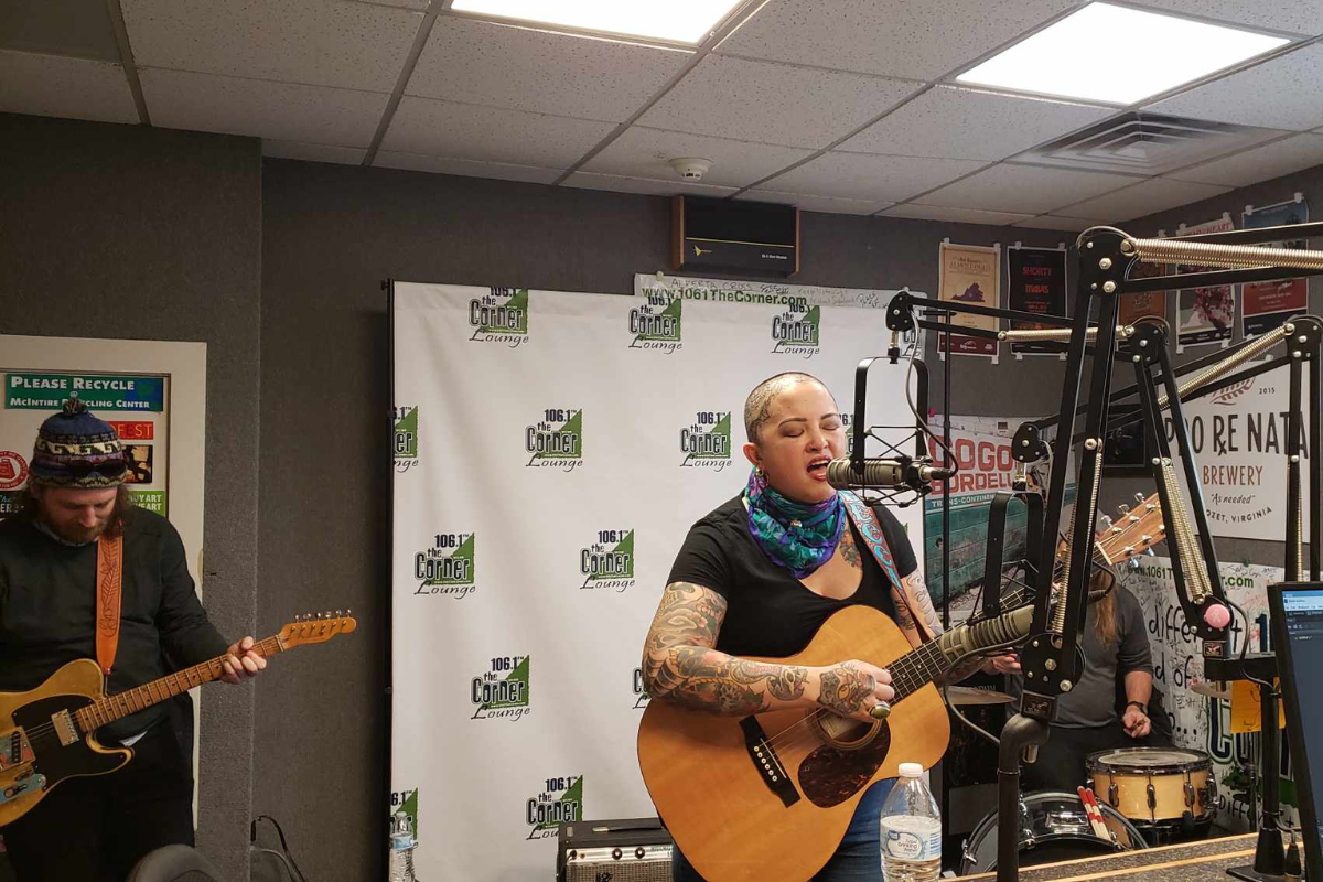 Rebecca Porter and the Rhinestone Roses singing and playing instruments in the Corner studio.