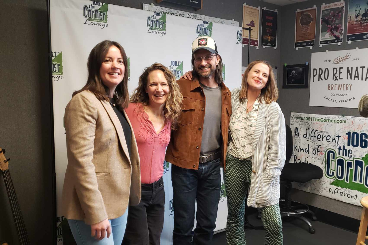 Charlottesville artist Mariana Bell on the right stands with three other friends in the 106.1 The Corner studio.