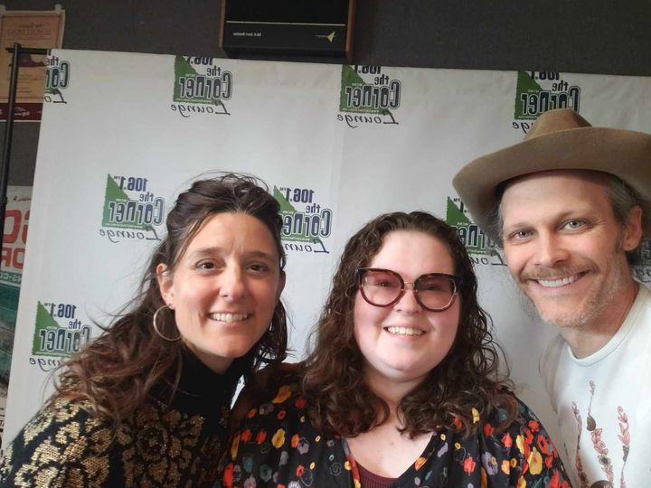 Suz Slezak, Samantha, and David Wax posing for a photo