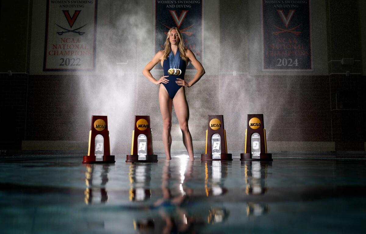 Gretchen Walsh NCAA trophies pose
