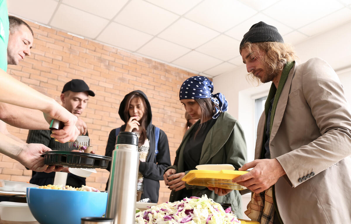 Volunteers serve food at the local food pantries