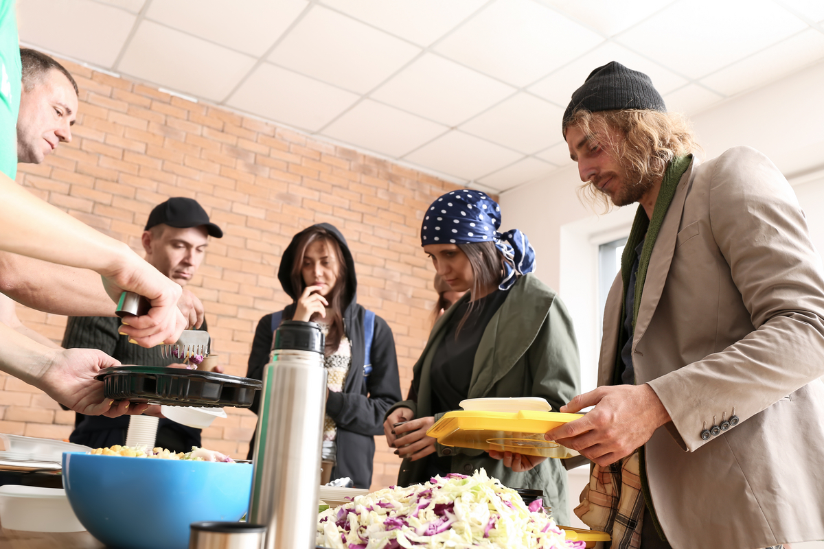 Volunteers serve food at the local food pantries