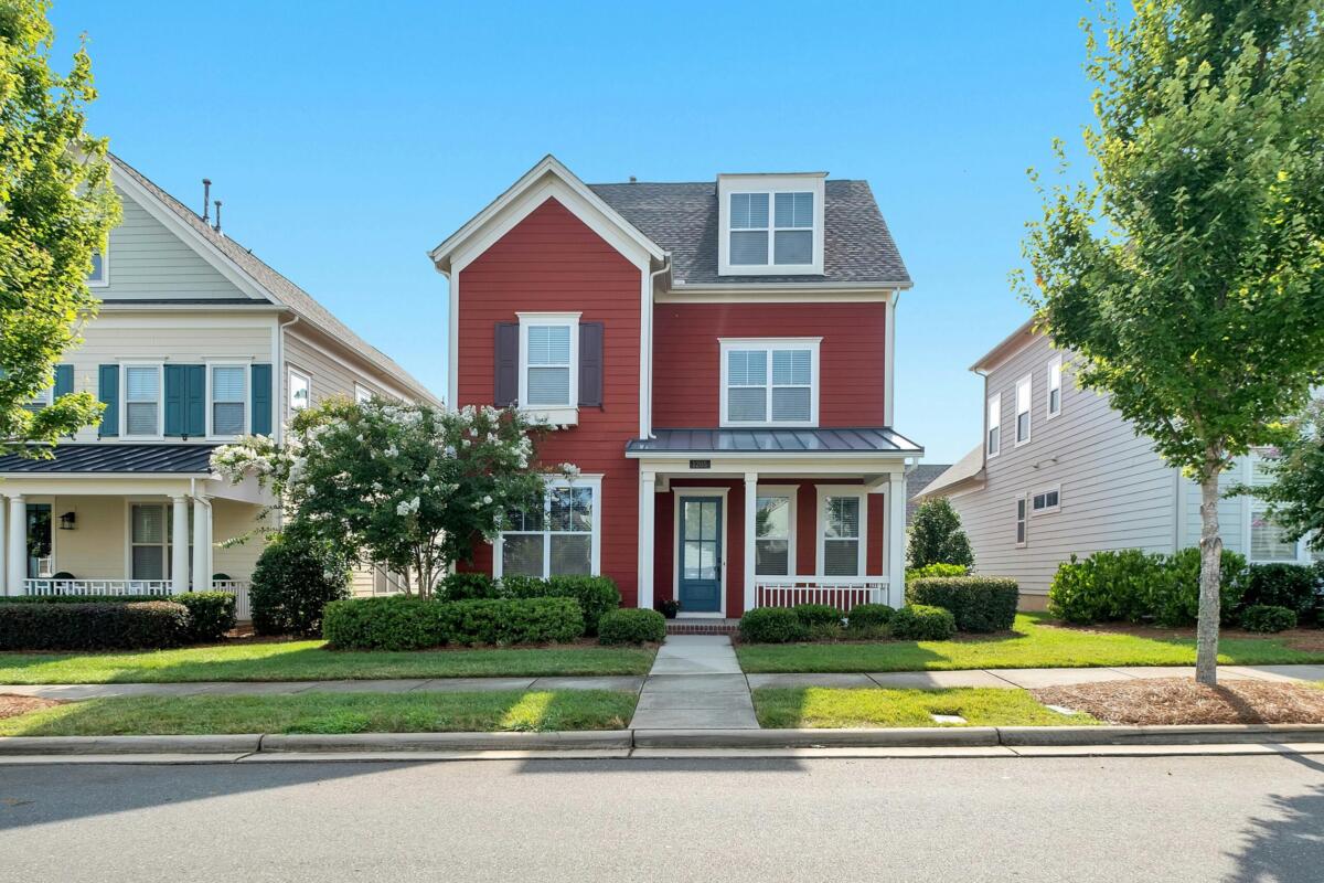 House with trees and sidewalk