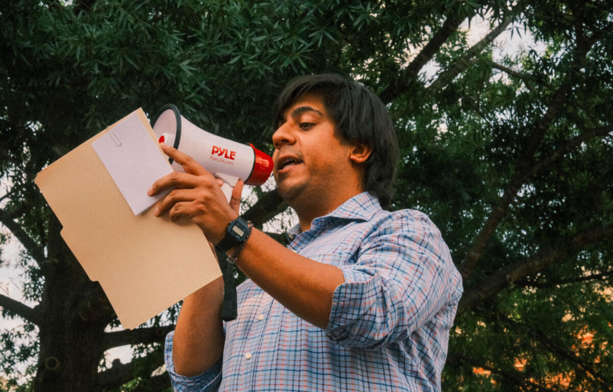 Javy Raudales speaks at a protest in Charlottesville.