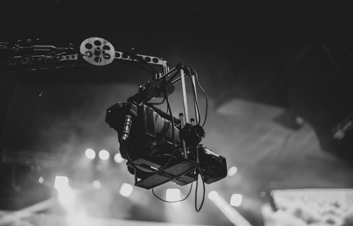 A suspended camera in black and white.