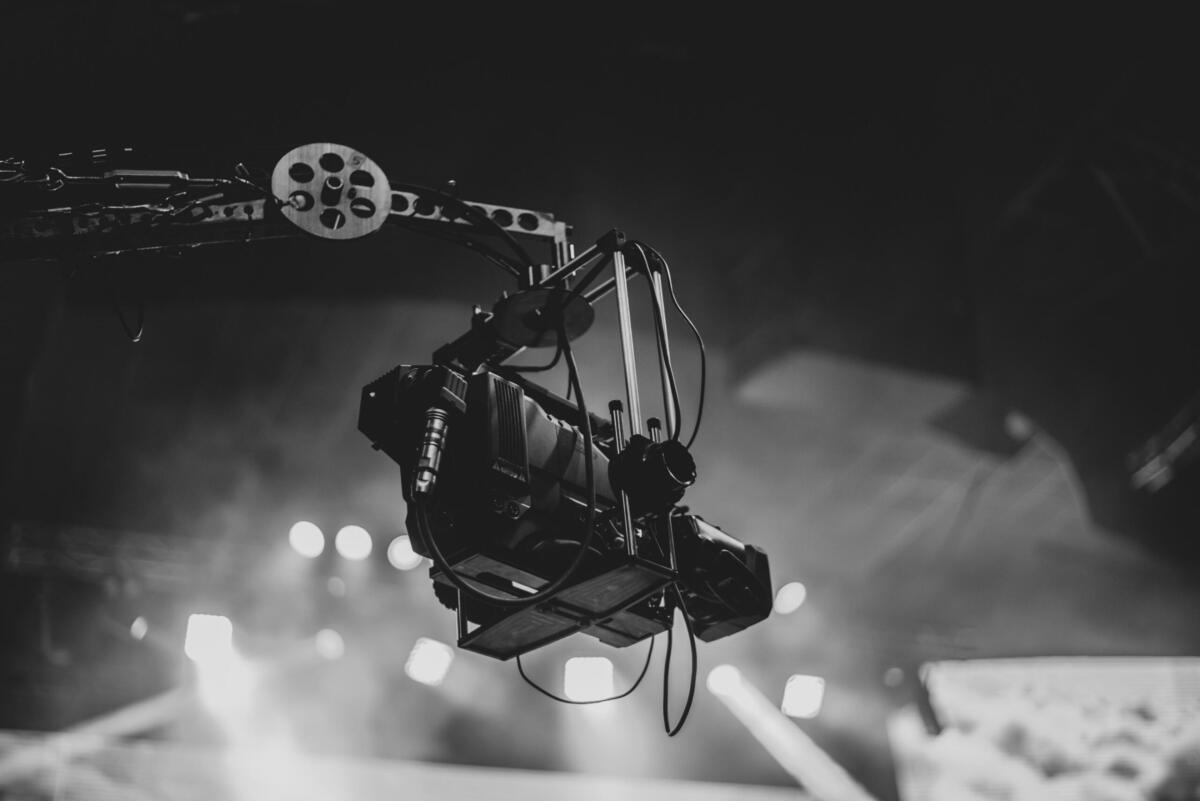 A suspended camera in black and white.