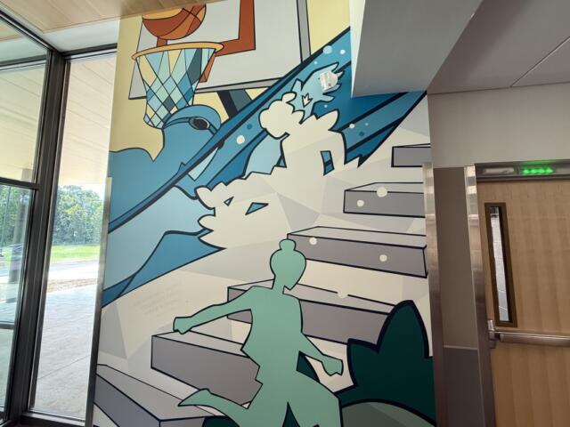 Cville Middle gym and arts entrance mural