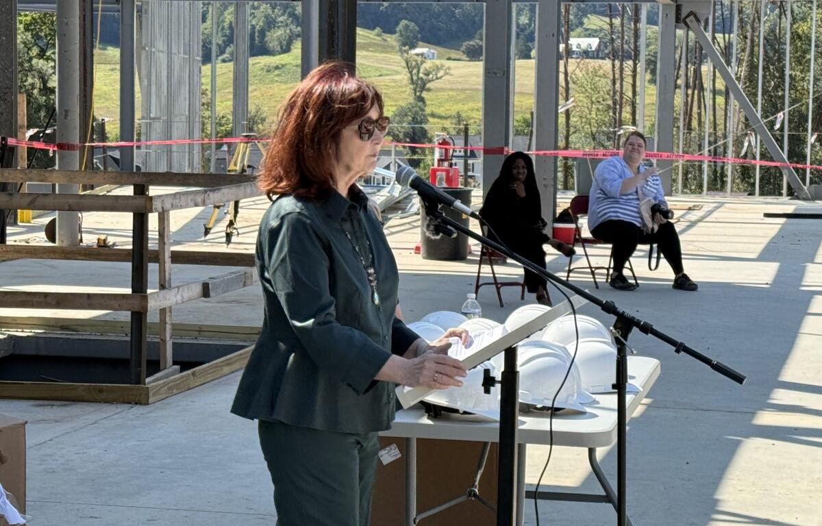 School Board Chair Kate Acuff addresses the ceremony