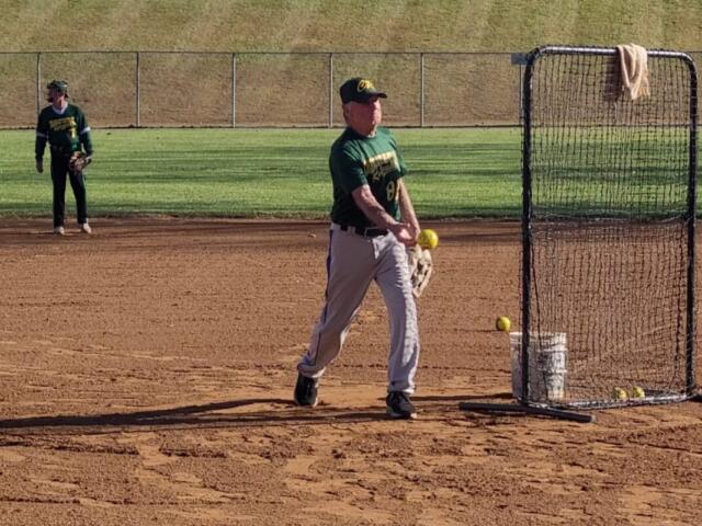 Larry Stremikis throwing batting practice
