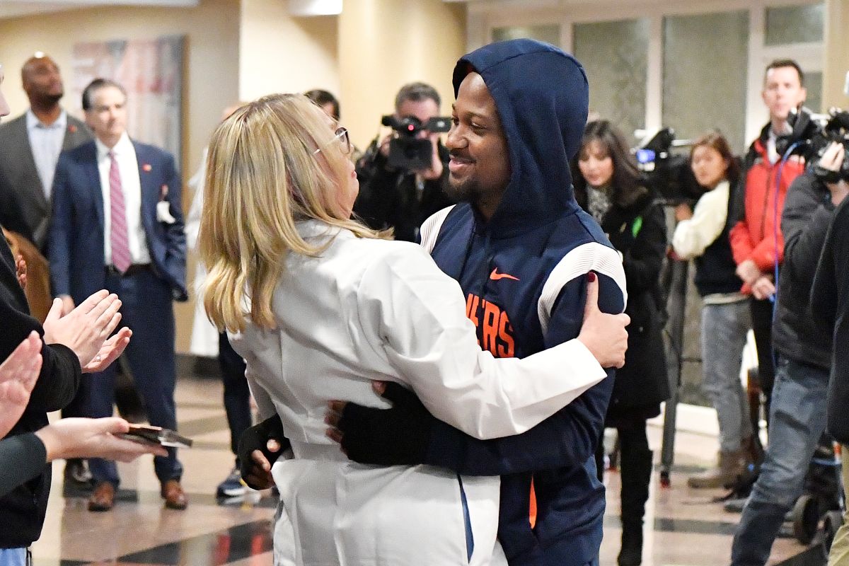 Perris Jones hugs a member of the UL Health team that assisted with his recovery as he is discharged from the hospital.