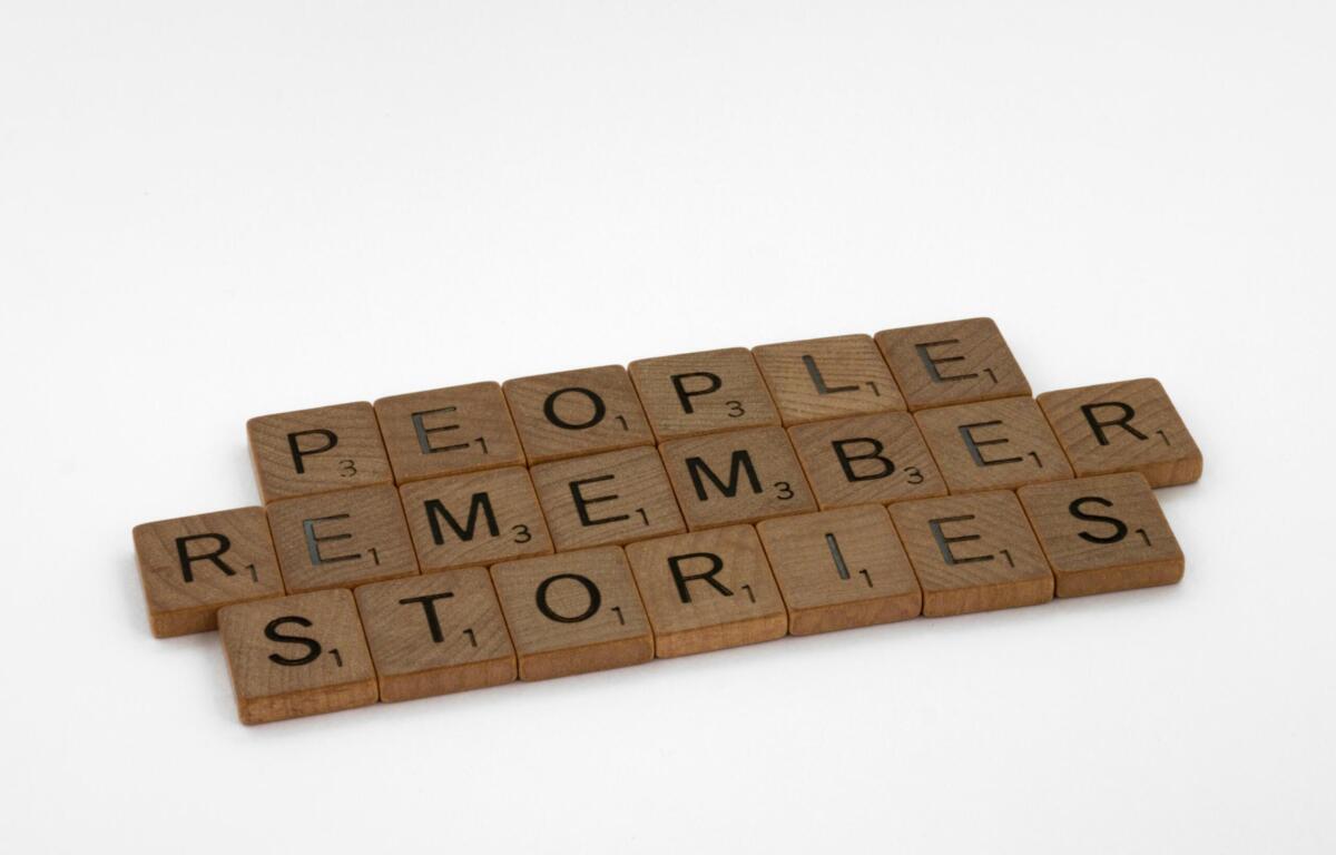 letter tiles spell out people remember stories