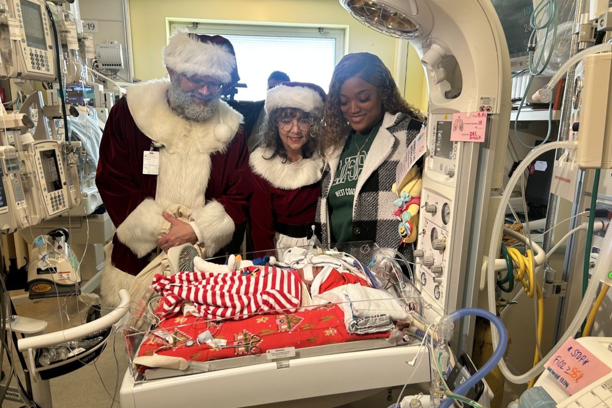 Santa visits a baby in the NICU