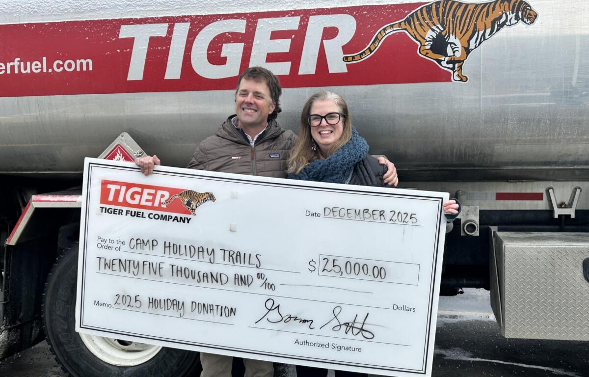 Tiger Fuel presents check to Camp Holiday Trail