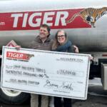 Tiger Fuel presents check to Camp Holiday Trail