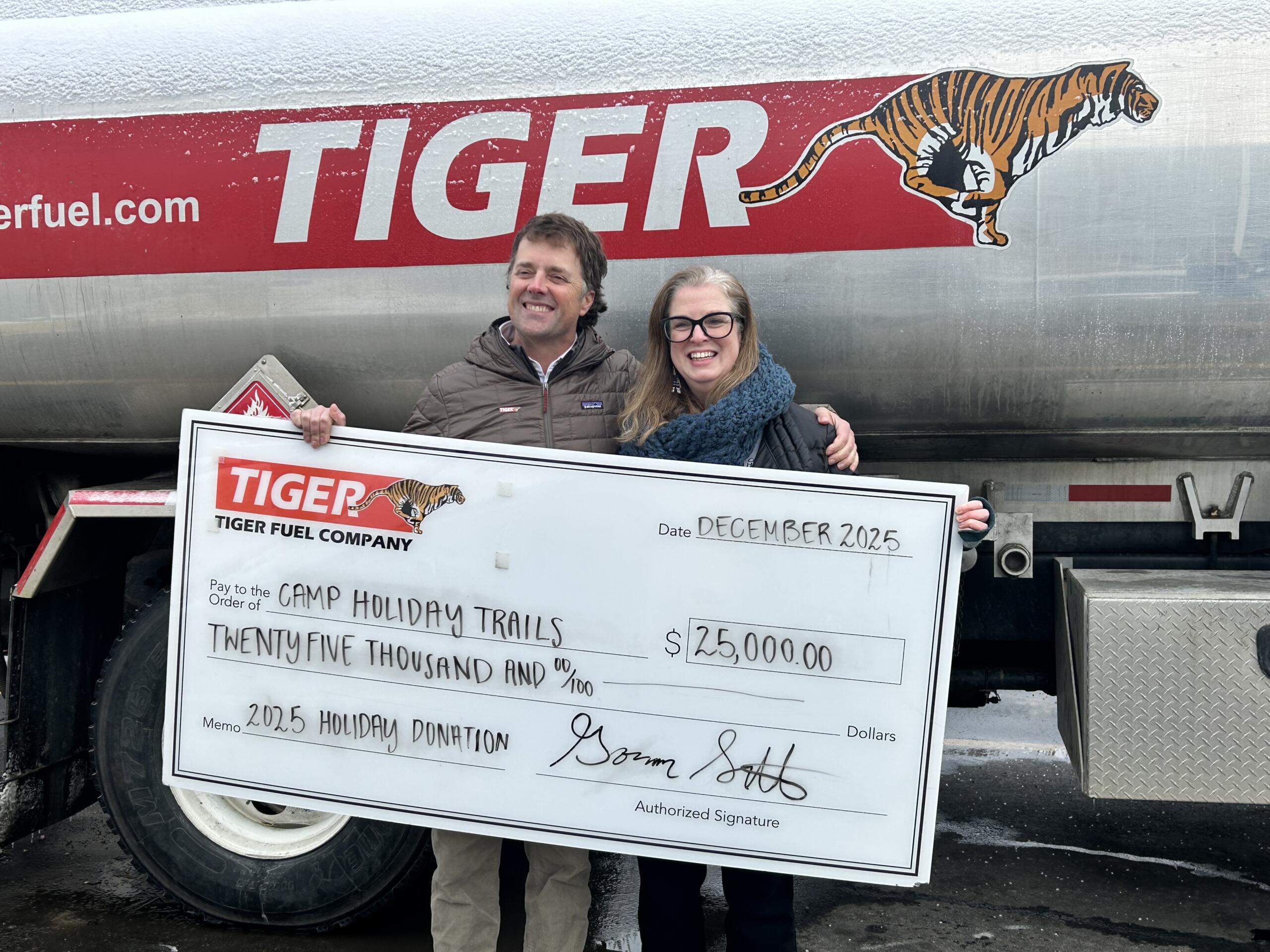 Tiger Fuel presents check to Camp Holiday Trail