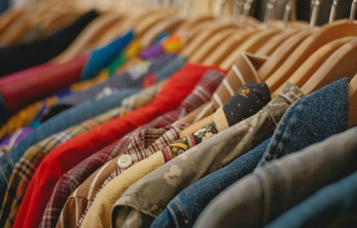 clothes hung on hangers on a rack