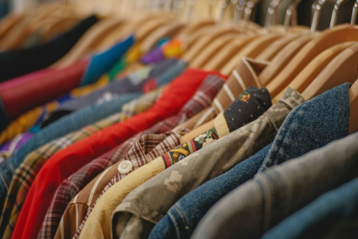 clothes hung on hangers on a rack