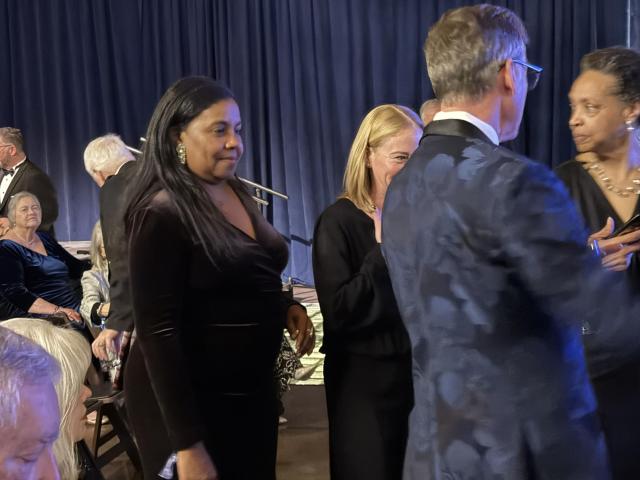 House Majority Leader Charniele Herring listens to a conversation