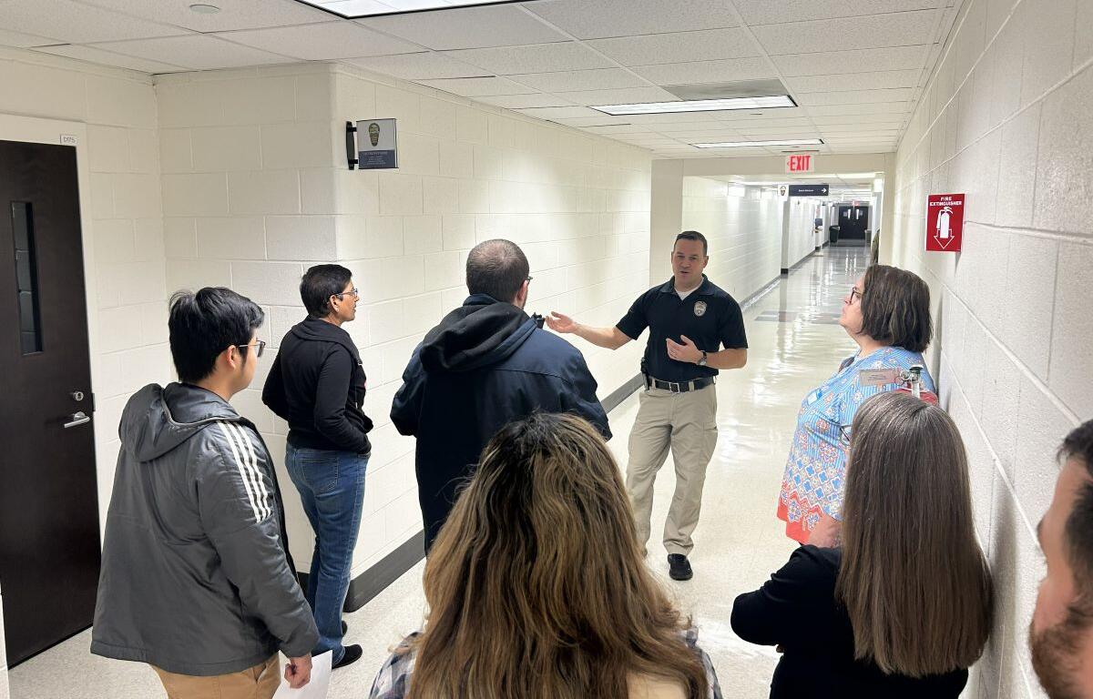 Master officer Joseph George gives a tour to police academy participants.