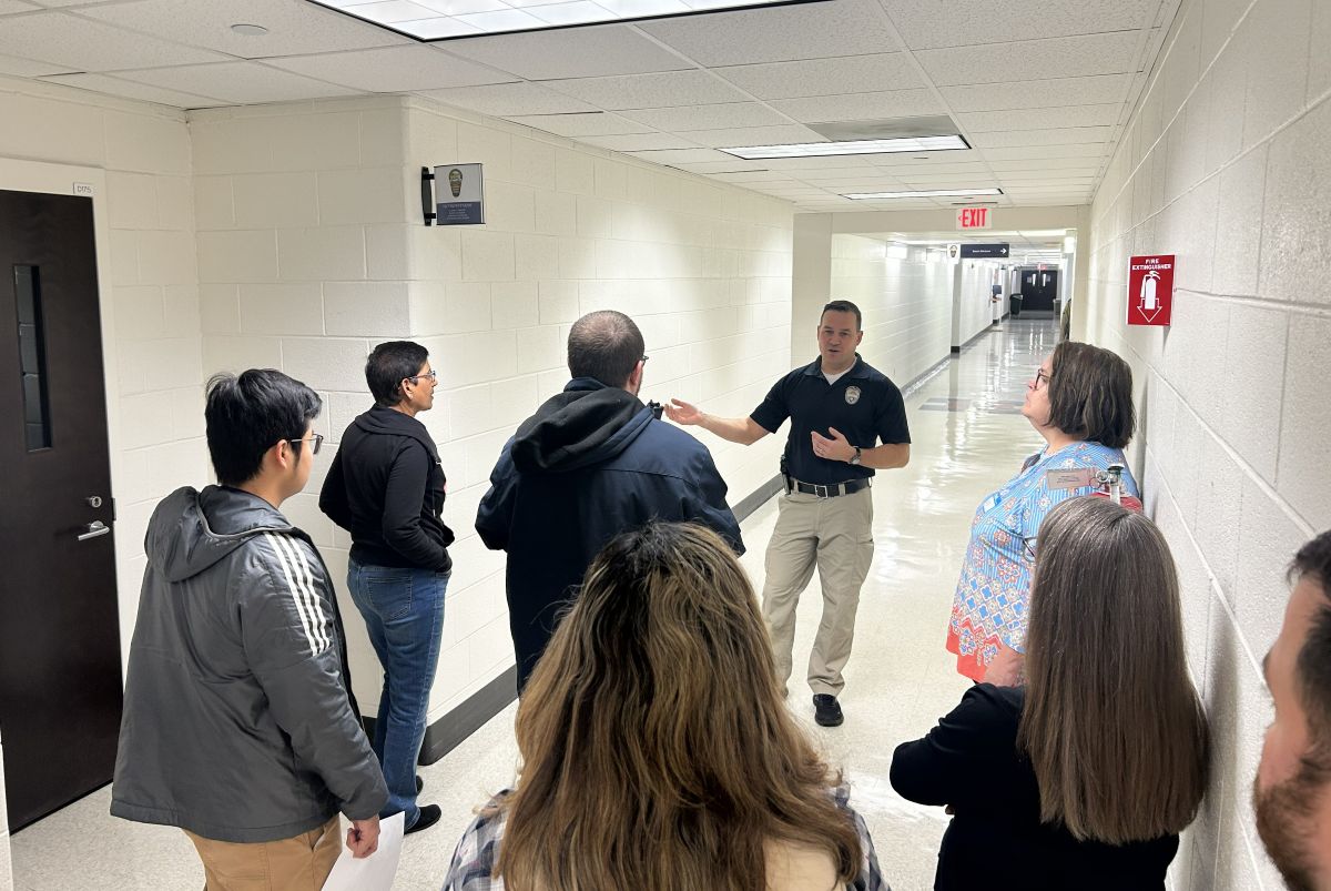 Master officer Joseph George gives a tour to police academy participants.