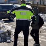 Officer helps student at Rose Hill and Westwood