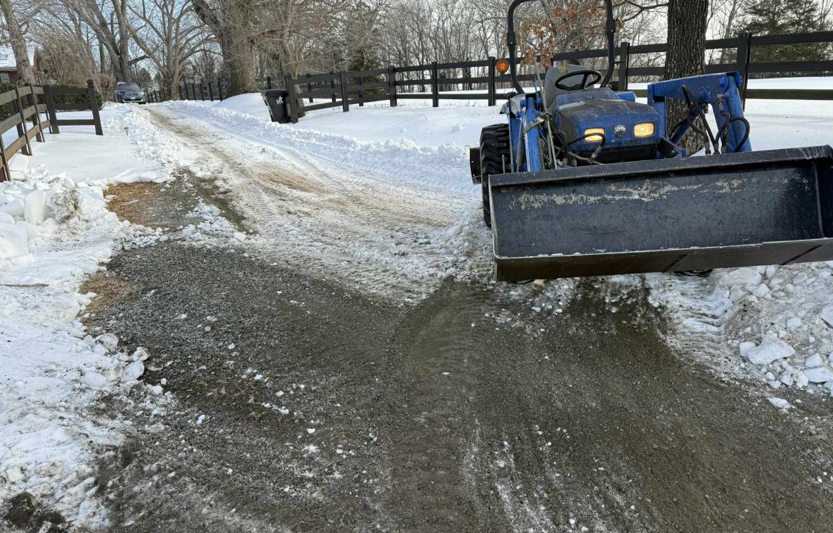 Tractor plowing driveways in Earlysville