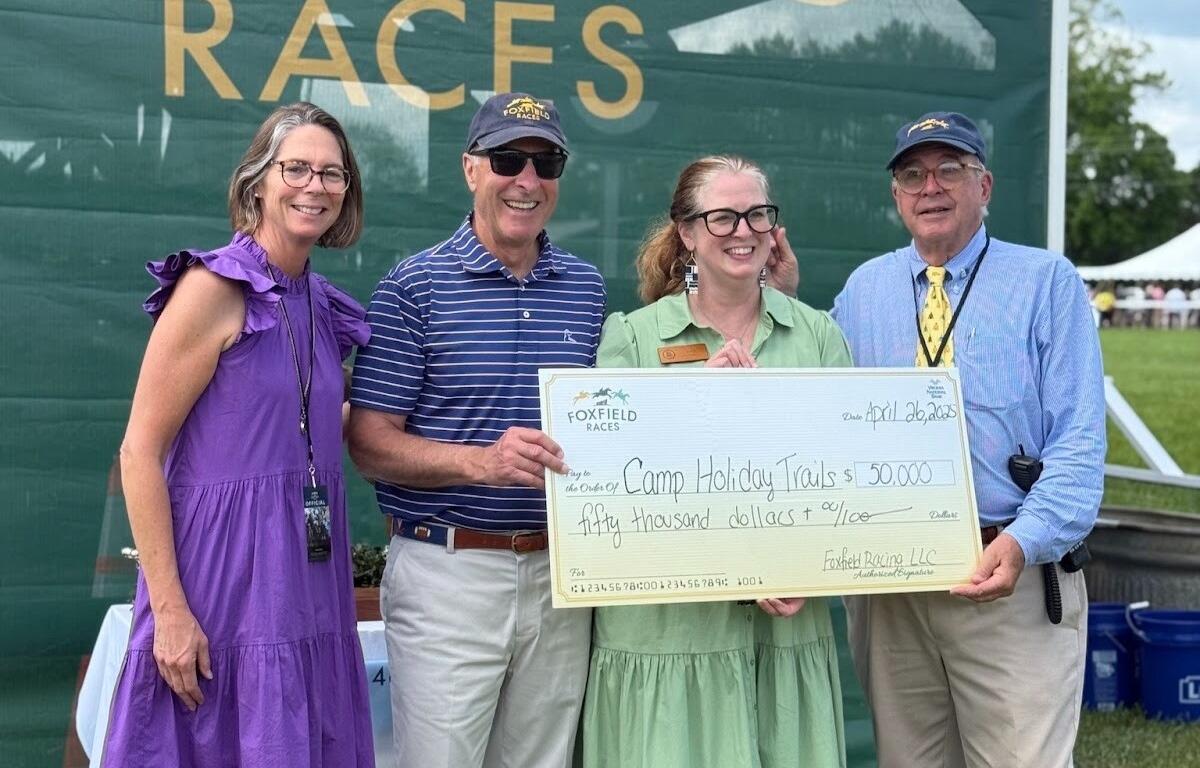 Foxfield presents a check to Camp Holiday Trails