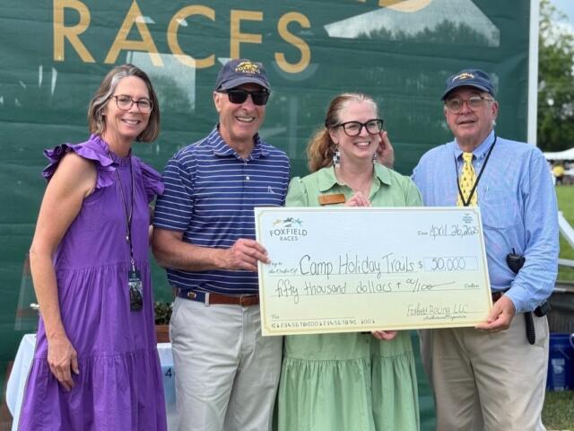 Foxfield presents a check to Camp Holiday Trails