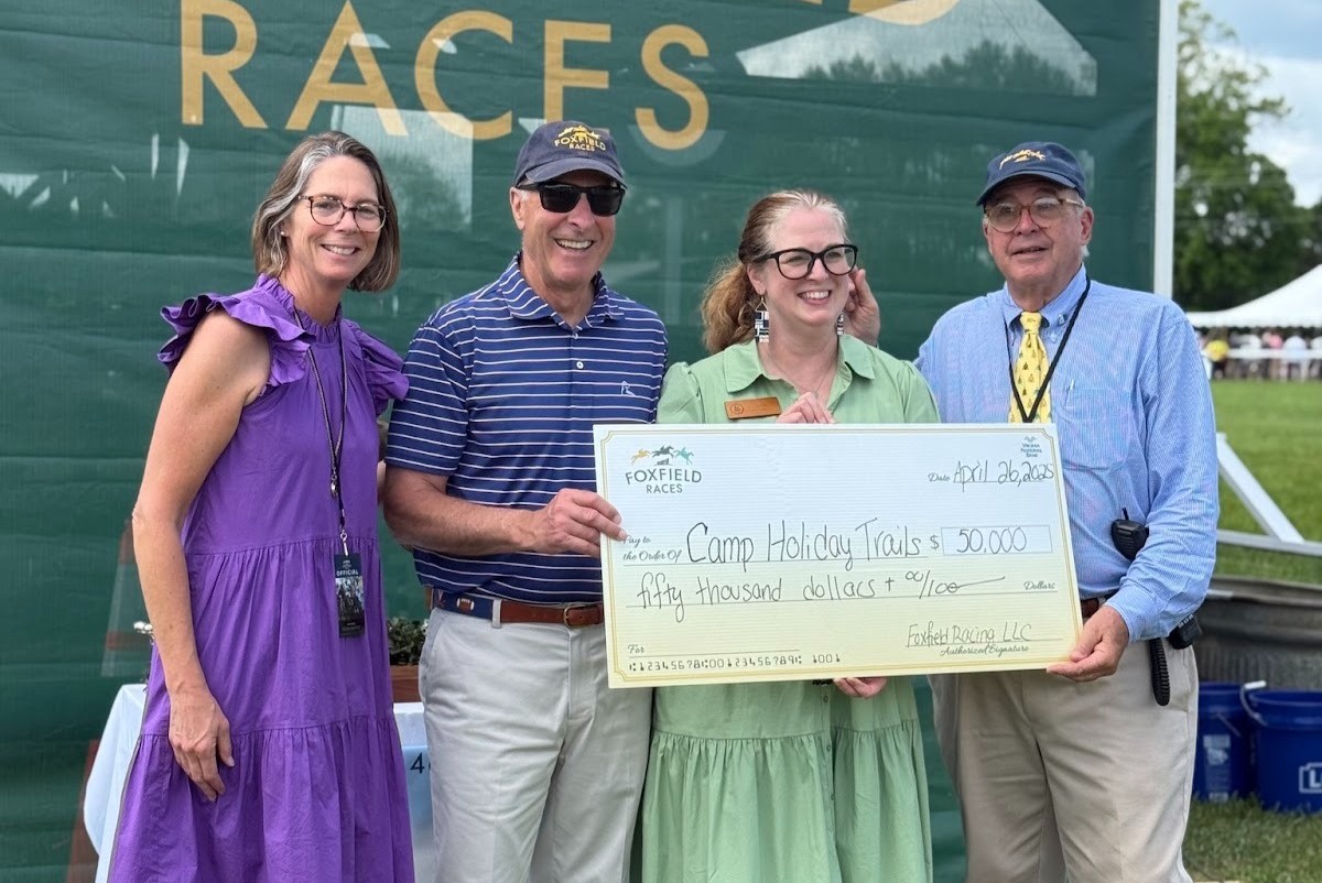 Foxfield presents a check to Camp Holiday Trails