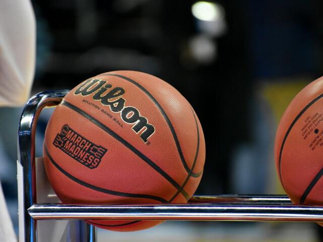 march madness basketball sitting on a rack