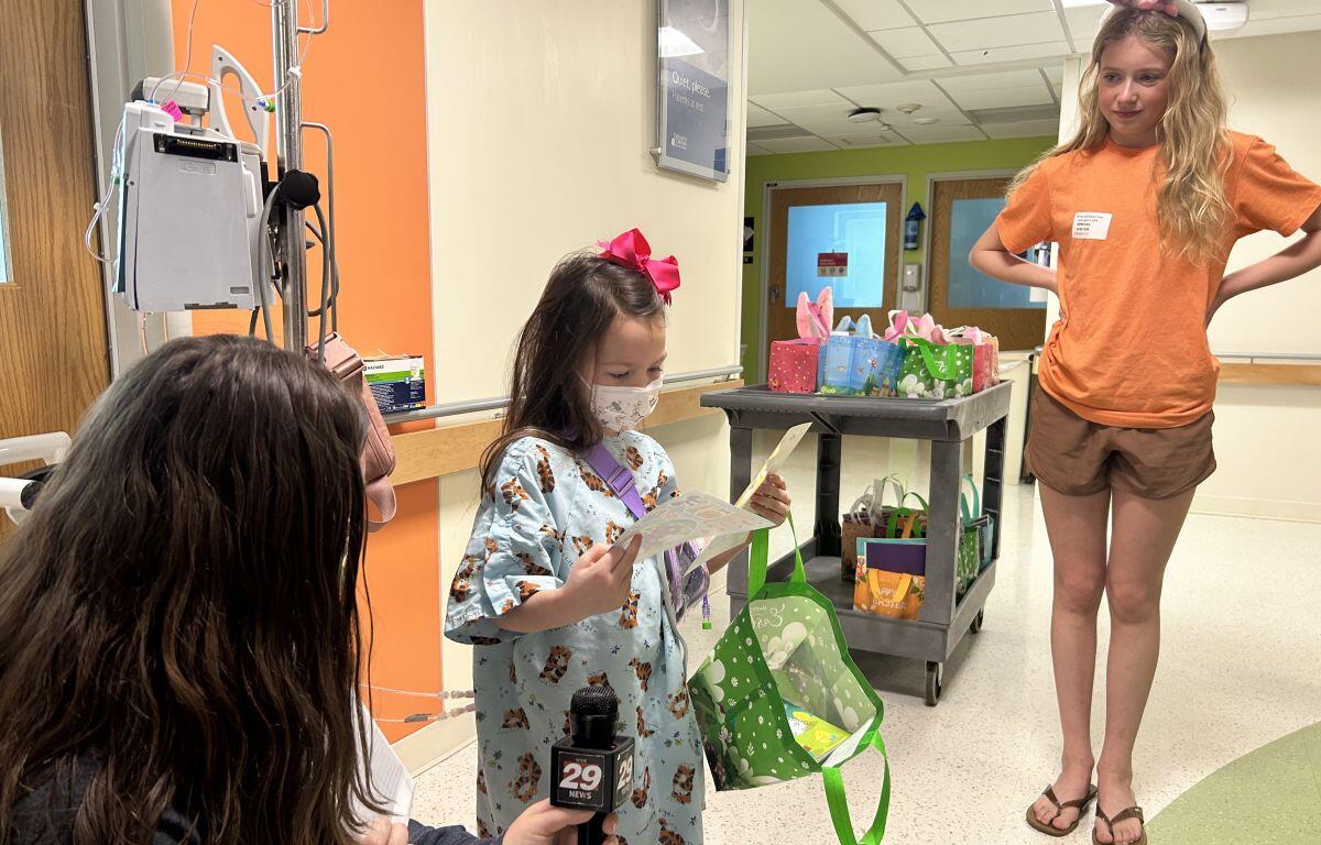 Five-year-old Bella receives an Easter basket at UVA Health