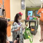 Five-year-old Bella receives an Easter basket at UVA Health