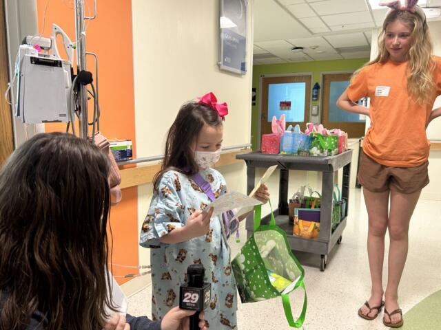 Five-year-old Bella receives an Easter basket at UVA Health