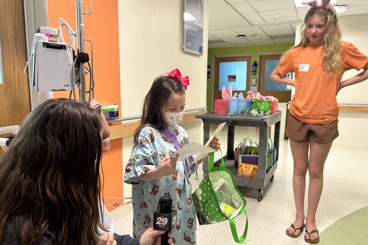 Five-year-old Bella receives an Easter basket at UVA Health