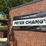 Brick exterior with a large 'Coming Soon' sign advertising Peter Chang's restaurant on a red brick wall.