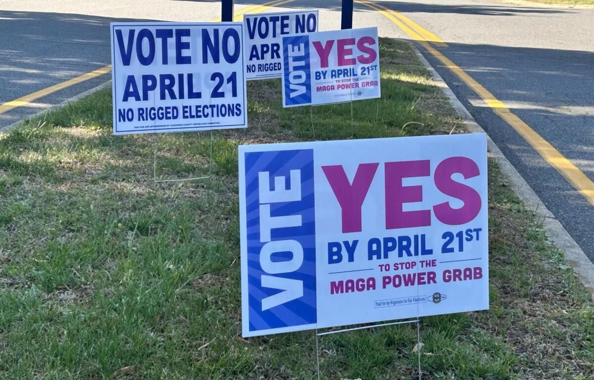 Campaign signs on a grassy roadside urging votes for April 21, some say 'Vote No' and others 'Yes' in bold letters.