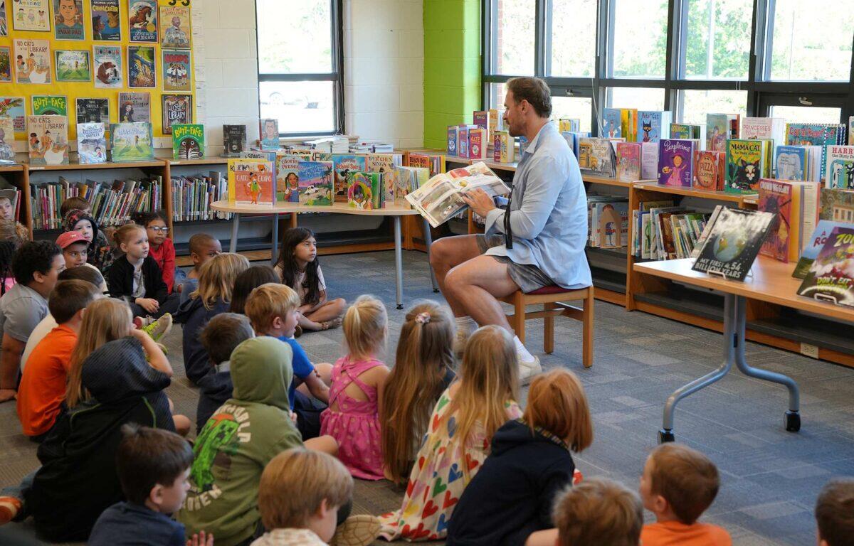 Chris Long reading to Scottsville Elementary School students, May 2026