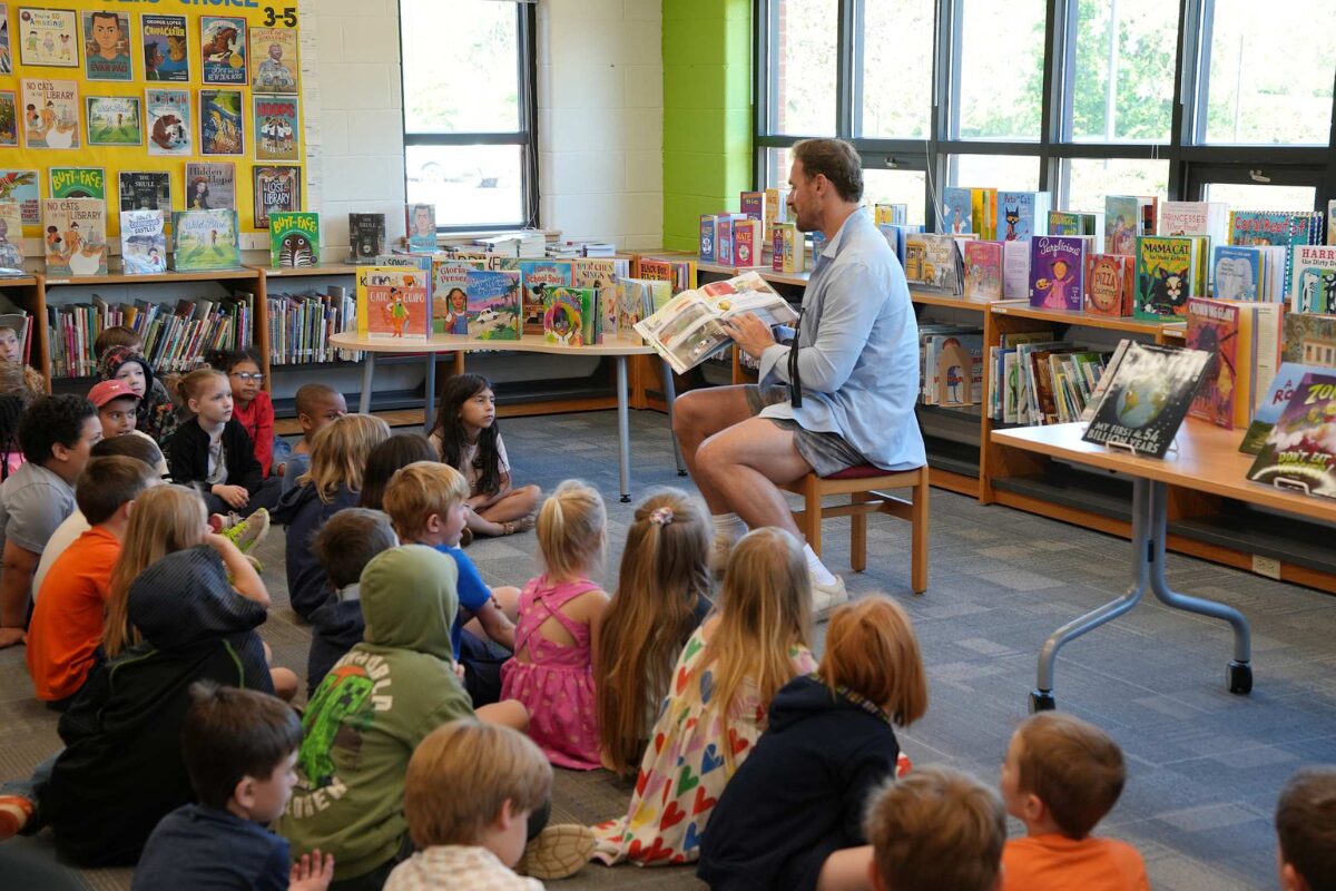 Chris Long reading to Scottsville Elementary School students, May 2026