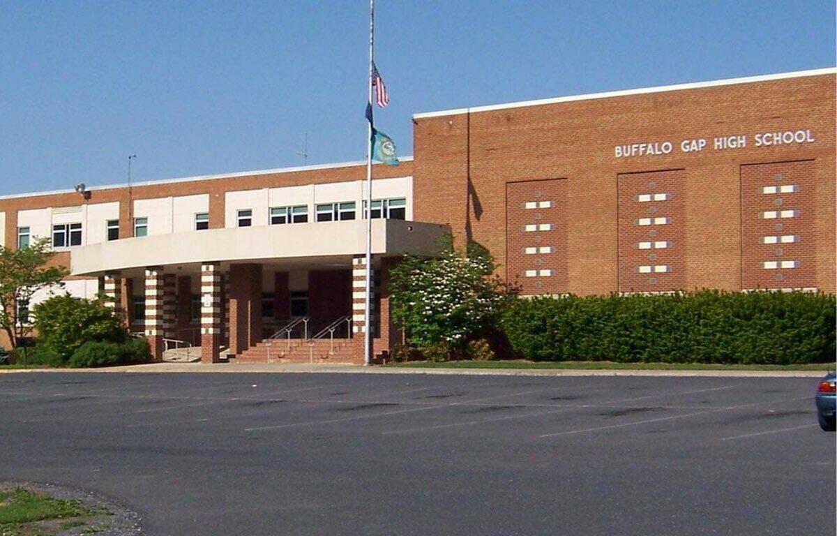 Front entrance of Buffalo Gap High School: brick facade, flagpole, and steps under a covered porte-cochere.