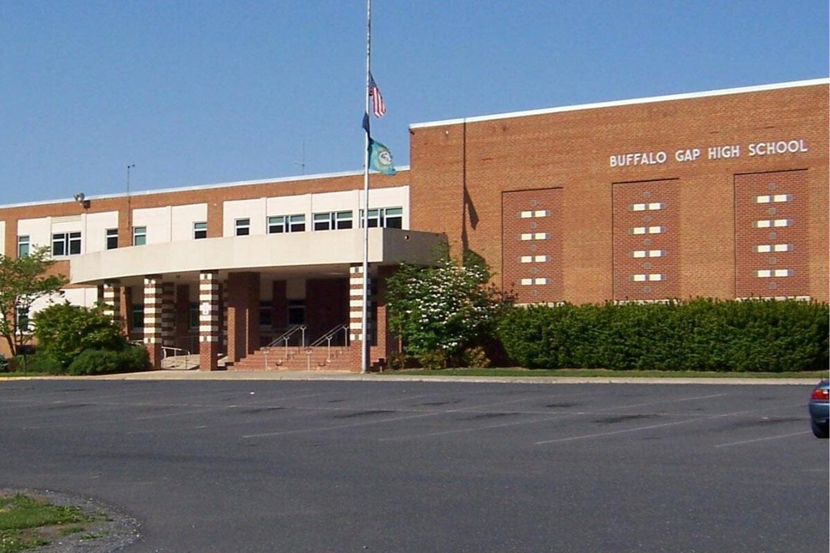 Front entrance of Buffalo Gap High School: brick facade, flagpole, and steps under a covered porte-cochere.