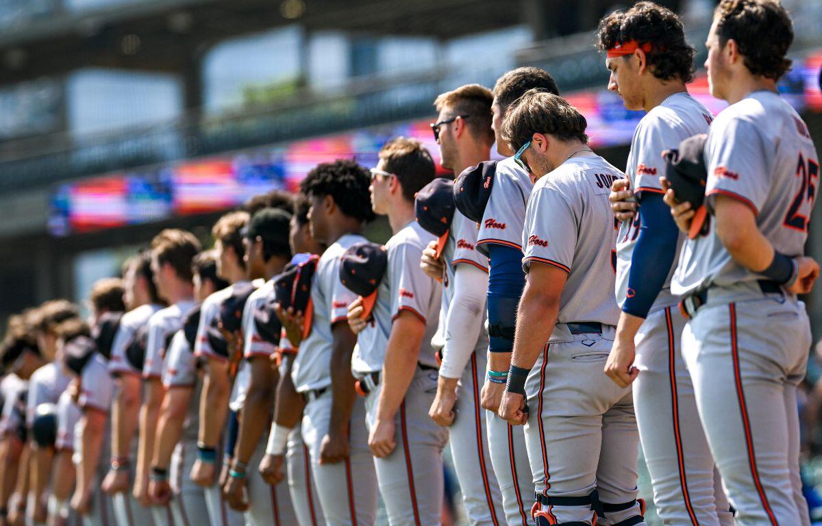 Virginia baseball players lined up for national anthem