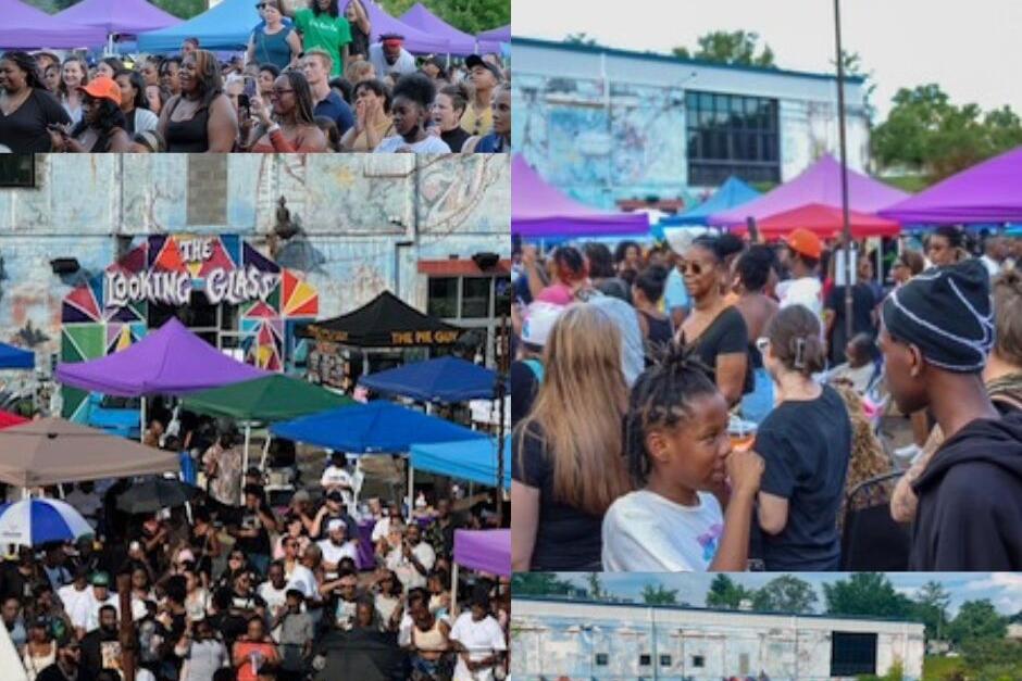 Crowd gathers at an outdoor festival with colorful tents and a mural backdrop in the background.