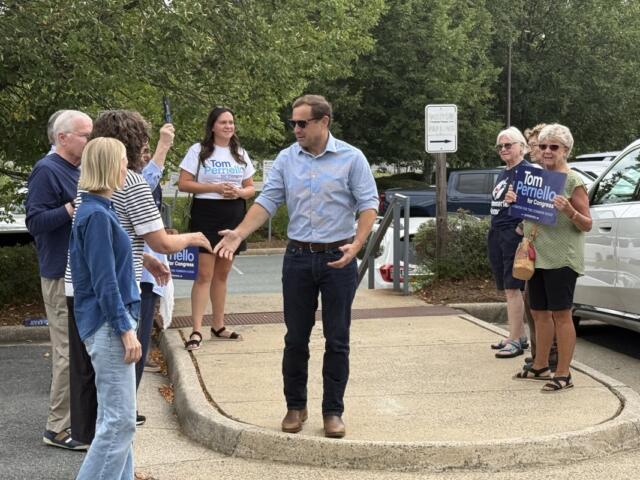 Tom Perriello greets supporters while early voting